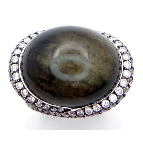 122 - A Head-Turning 18K White Gold, Diamond and Chrysoberyl (cat's eye) Ring. A large c.15ct chrysoberyl ... 
