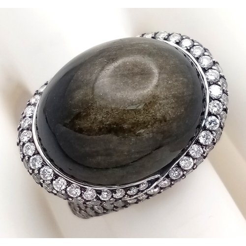 122 - A Head-Turning 18K White Gold, Diamond and Chrysoberyl (cat's eye) Ring. A large c.15ct chrysoberyl ... 