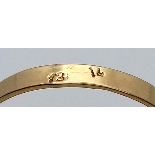 163 - An 18K Yellow Gold (tests as) Turquoise Ring. A large pale blue turquoise cabochon in a decorative s... 