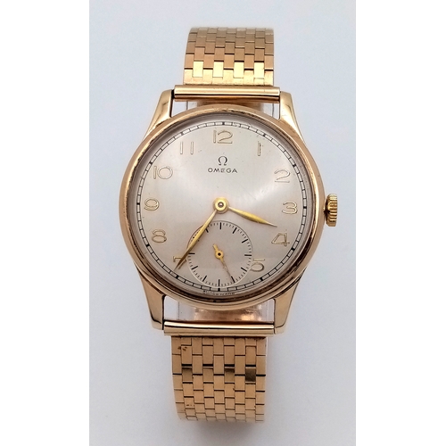 157 - A Vintage Omega 9K Gold Gents Dress Watch. 9k gold bracelet and case - 34mm. Cream dial with second ... 