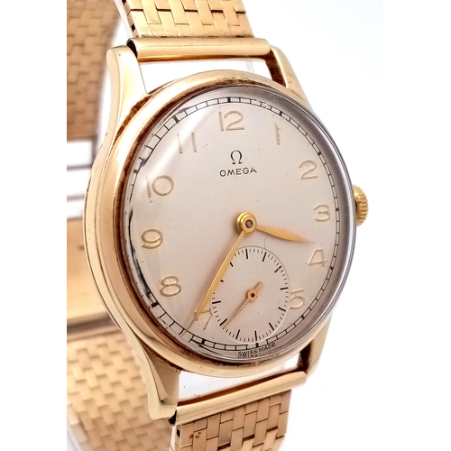 157 - A Vintage Omega 9K Gold Gents Dress Watch. 9k gold bracelet and case - 34mm. Cream dial with second ... 