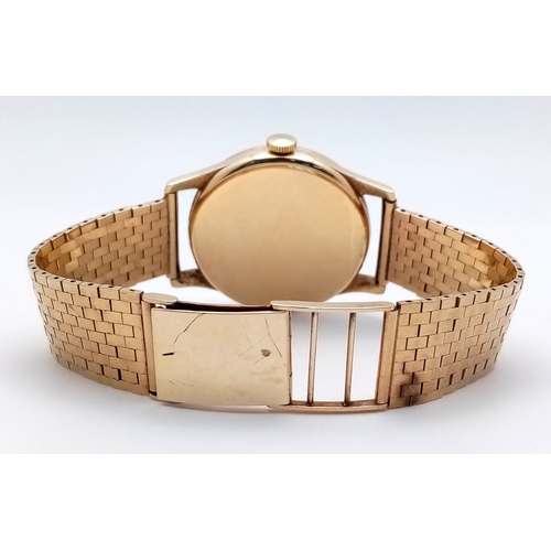 157 - A Vintage Omega 9K Gold Gents Dress Watch. 9k gold bracelet and case - 34mm. Cream dial with second ... 