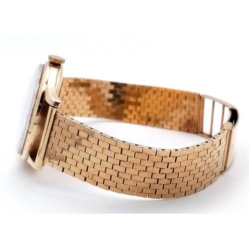 157 - A Vintage Omega 9K Gold Gents Dress Watch. 9k gold bracelet and case - 34mm. Cream dial with second ... 