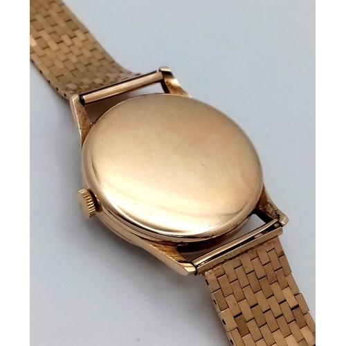 157 - A Vintage Omega 9K Gold Gents Dress Watch. 9k gold bracelet and case - 34mm. Cream dial with second ... 