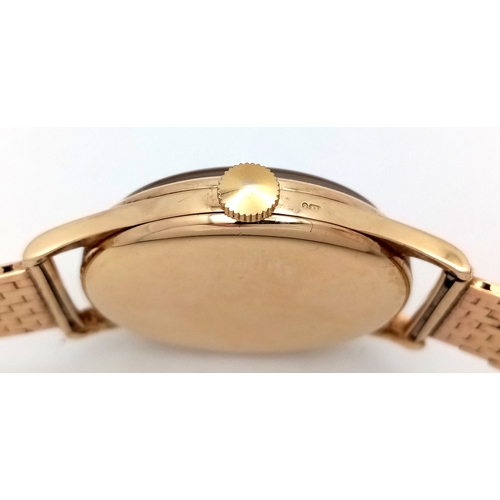 157 - A Vintage Omega 9K Gold Gents Dress Watch. 9k gold bracelet and case - 34mm. Cream dial with second ... 