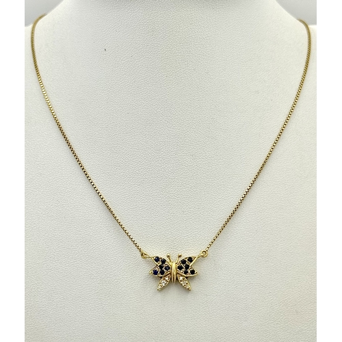27 - A 18K YELOW GOLD DIAMOND & SAPPHIRE SET BUTTERFLY PENDANT ON CHAIN. TOTAL WEIGHT 5.8G. TOTAL LENGTH ... 