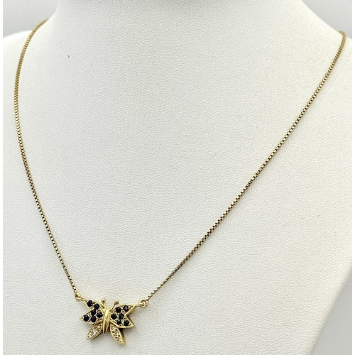 27 - A 18K YELOW GOLD DIAMOND & SAPPHIRE SET BUTTERFLY PENDANT ON CHAIN. TOTAL WEIGHT 5.8G. TOTAL LENGTH ... 