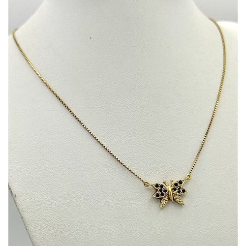 27 - A 18K YELOW GOLD DIAMOND & SAPPHIRE SET BUTTERFLY PENDANT ON CHAIN. TOTAL WEIGHT 5.8G. TOTAL LENGTH ... 