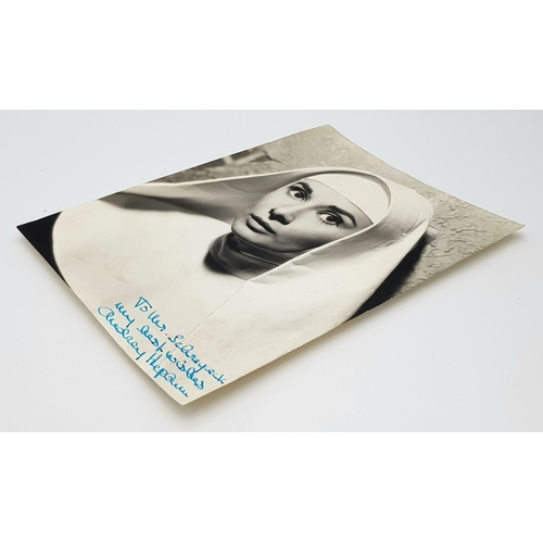 24 - An Audrey Hepburn Signed 'The Nun's Story' Headshot. Original, personalised signed photograph by Aud... 