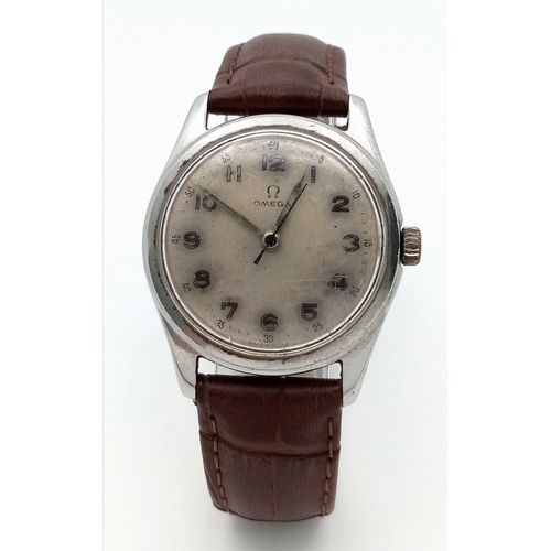 17 - A Vintage Omega Mechanical (hand-wind) Gents Watch. Brown leather strap. Stainless steel case - 34mm... 