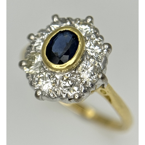 110 - AN 18K YELLOW GOLD DIAMOND & SAPPHIRE CLUSTER RING. DIAMOND WEIGHT 0.75CT. TOTAL WEIGHT 3.3G. SIZE N... 