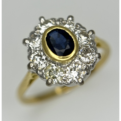 110 - AN 18K YELLOW GOLD DIAMOND & SAPPHIRE CLUSTER RING. DIAMOND WEIGHT 0.75CT. TOTAL WEIGHT 3.3G. SIZE N... 