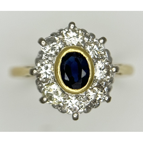 110 - AN 18K YELLOW GOLD DIAMOND & SAPPHIRE CLUSTER RING. DIAMOND WEIGHT 0.75CT. TOTAL WEIGHT 3.3G. SIZE N... 