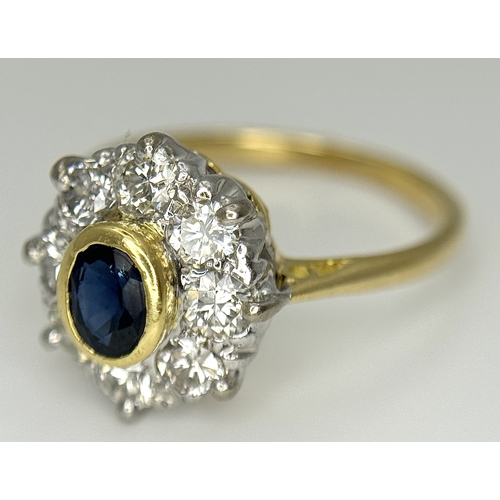 110 - AN 18K YELLOW GOLD DIAMOND & SAPPHIRE CLUSTER RING. DIAMOND WEIGHT 0.75CT. TOTAL WEIGHT 3.3G. SIZE N... 