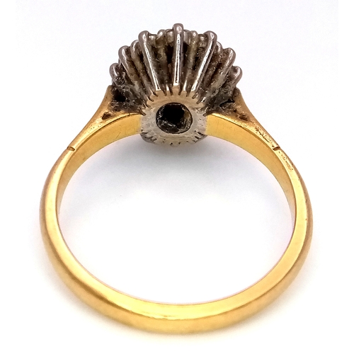 65 - An 18K Yellow Gold Opal and Diamond Ring. A 1ct central opal with a 0.52ctw diamond surround. Size N... 