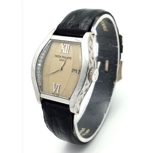 88 - A Patek Philippe 18K White Gold and Diamond Gondolo Ladies Watch. Model 4949. New strap with origina... 