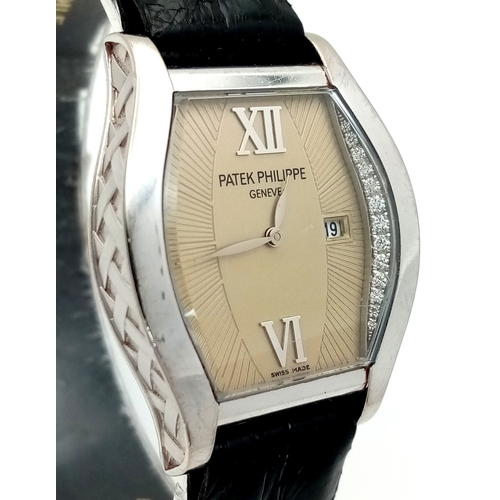 88 - A Patek Philippe 18K White Gold and Diamond Gondolo Ladies Watch. Model 4949. New strap with origina... 
