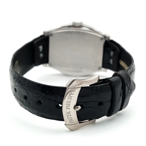 88 - A Patek Philippe 18K White Gold and Diamond Gondolo Ladies Watch. Model 4949. New strap with origina... 