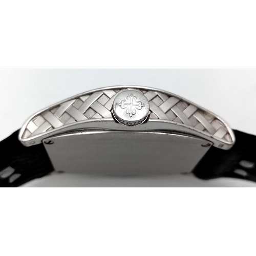 88 - A Patek Philippe 18K White Gold and Diamond Gondolo Ladies Watch. Model 4949. New strap with origina... 