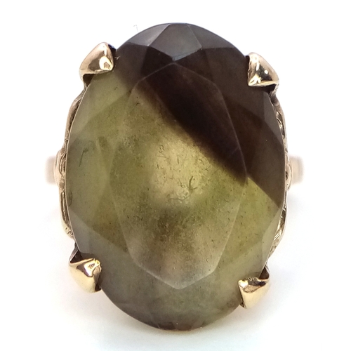 93 - A 9K Yellow Gold Smoky Quartz Ring. 5.75g.
