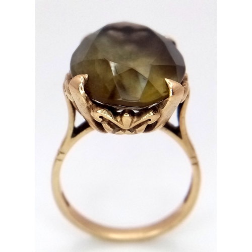 93 - A 9K Yellow Gold Smoky Quartz Ring. 5.75g.