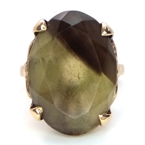 93 - A 9K Yellow Gold Smoky Quartz Ring. 5.75g.