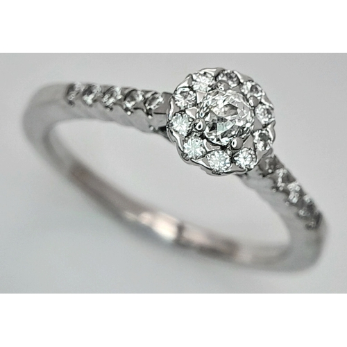 106 - A 14K WHITE GOLD DIAMOND HALO RING. DIAMOND WEIGHT 0.49CT. TOTAL WEIGHT 3.2G. SIZE P. SC 8056
