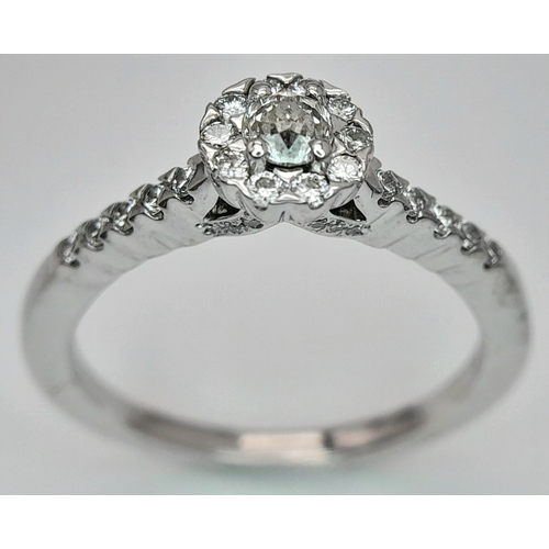 106 - A 14K WHITE GOLD DIAMOND HALO RING. DIAMOND WEIGHT 0.49CT. TOTAL WEIGHT 3.2G. SIZE P. SC 8056