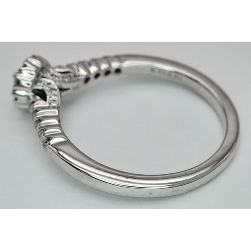 106 - A 14K WHITE GOLD DIAMOND HALO RING. DIAMOND WEIGHT 0.49CT. TOTAL WEIGHT 3.2G. SIZE P. SC 8056