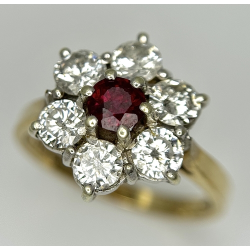 117 - A 9K YELLOW GOLD DIAMOND & RUBY FLOWER CLUSTER RING. 1.20CT DIAMOND AND RUBY APPROX 0.3CT IN WEIGHT.... 