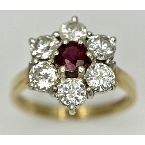 117 - A 9K YELLOW GOLD DIAMOND & RUBY FLOWER CLUSTER RING. 1.20CT DIAMOND AND RUBY APPROX 0.3CT IN WEIGHT.... 