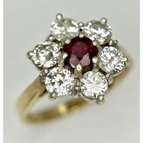 117 - A 9K YELLOW GOLD DIAMOND & RUBY FLOWER CLUSTER RING. 1.20CT DIAMOND AND RUBY APPROX 0.3CT IN WEIGHT.... 