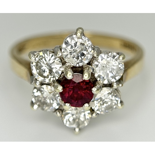 117 - A 9K YELLOW GOLD DIAMOND & RUBY FLOWER CLUSTER RING. 1.20CT DIAMOND AND RUBY APPROX 0.3CT IN WEIGHT.... 