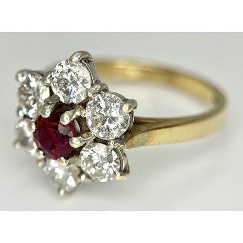 117 - A 9K YELLOW GOLD DIAMOND & RUBY FLOWER CLUSTER RING. 1.20CT DIAMOND AND RUBY APPROX 0.3CT IN WEIGHT.... 