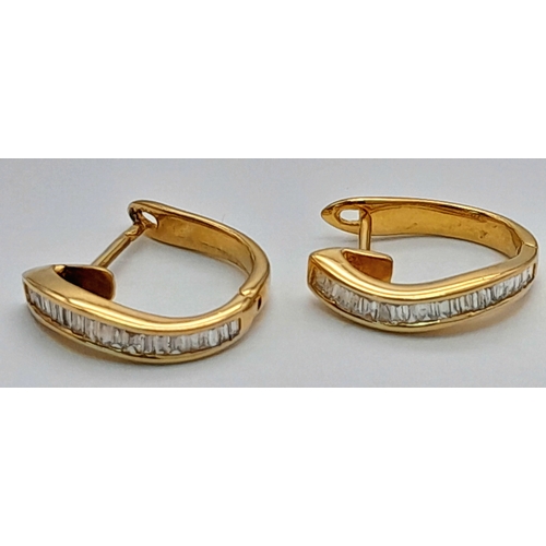 120 - A PAIR OF 18K YELOW GOLD BAGUETTE CUT DIAMOND SET HOOP EARRINGS. TOTAL WEIGHT 2.3G. DIAMOND WEIGHT 0... 