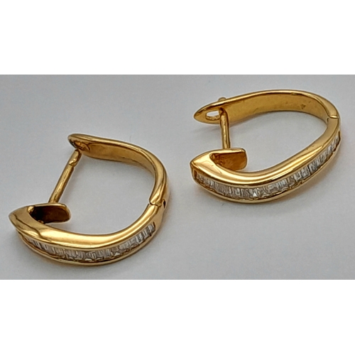 120 - A PAIR OF 18K YELOW GOLD BAGUETTE CUT DIAMOND SET HOOP EARRINGS. TOTAL WEIGHT 2.3G. DIAMOND WEIGHT 0... 