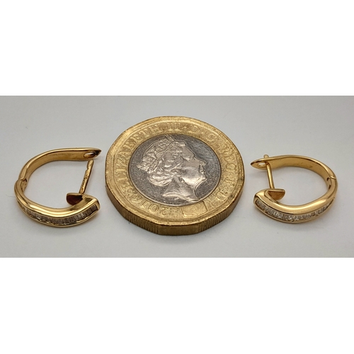 120 - A PAIR OF 18K YELOW GOLD BAGUETTE CUT DIAMOND SET HOOP EARRINGS. TOTAL WEIGHT 2.3G. DIAMOND WEIGHT 0... 