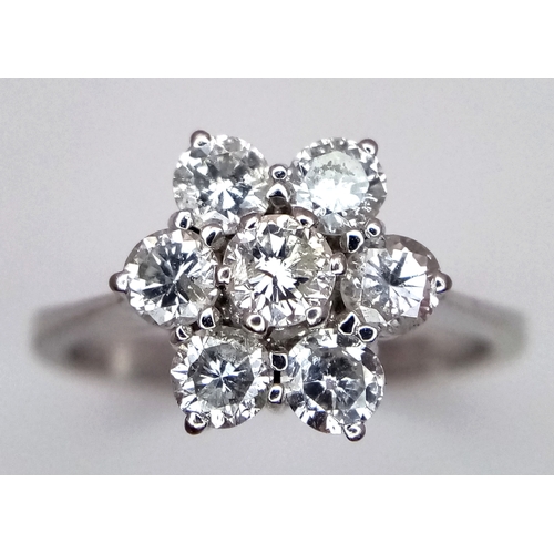 152 - A 9K WHITE GOLD DIAMOND FLORAL CLUSTER RING. DIAMOND WEIGHT 0.70CT. TOTAL WEIGHT 3G. SIZE N. SPSA 20... 