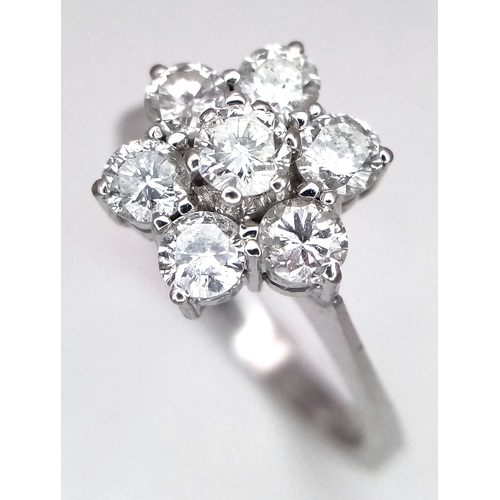 152 - A 9K WHITE GOLD DIAMOND FLORAL CLUSTER RING. DIAMOND WEIGHT 0.70CT. TOTAL WEIGHT 3G. SIZE N. SPSA 20... 