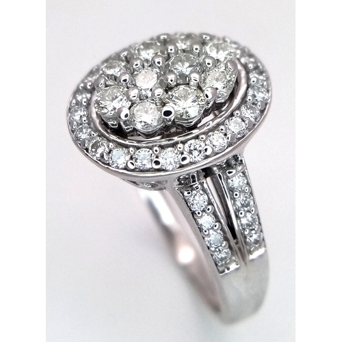 68 - AN 18K WHITE GOLD DIAMOND RING. DIAMOND WEIGHT 1CT. TOTAL WEIGHT 6.5G. SIZE Q. SPSA 1003
