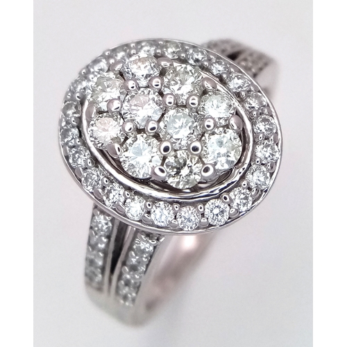 68 - AN 18K WHITE GOLD DIAMOND RING. DIAMOND WEIGHT 1CT. TOTAL WEIGHT 6.5G. SIZE Q. SPSA 1003