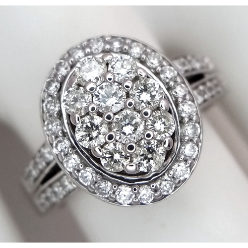 68 - AN 18K WHITE GOLD DIAMOND RING. DIAMOND WEIGHT 1CT. TOTAL WEIGHT 6.5G. SIZE Q. SPSA 1003