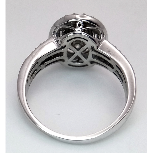 68 - AN 18K WHITE GOLD DIAMOND RING. DIAMOND WEIGHT 1CT. TOTAL WEIGHT 6.5G. SIZE Q. SPSA 1003