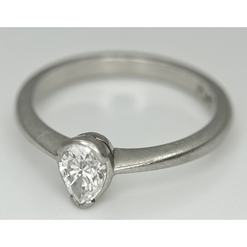 82 - A PLATINUM DIAMOND SOLITAIRE RING. DIAMOND WEIGHT 0.50CT. PEAR SHAPE CUT DIAMOND RUBOVER SET. TOTAL ... 