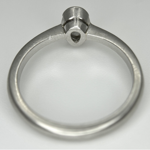 82 - A PLATINUM DIAMOND SOLITAIRE RING. DIAMOND WEIGHT 0.50CT. PEAR SHAPE CUT DIAMOND RUBOVER SET. TOTAL ... 