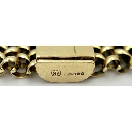 87 - A Glamourous Vintage 9K Yellow Gold Necklace and Bracelet Set. Intricate curved links create a stunn... 