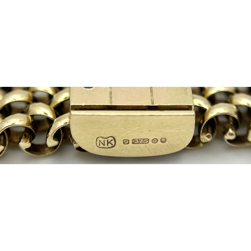 87 - A Glamourous Vintage 9K Yellow Gold Necklace and Bracelet Set. Intricate curved links create a stunn... 