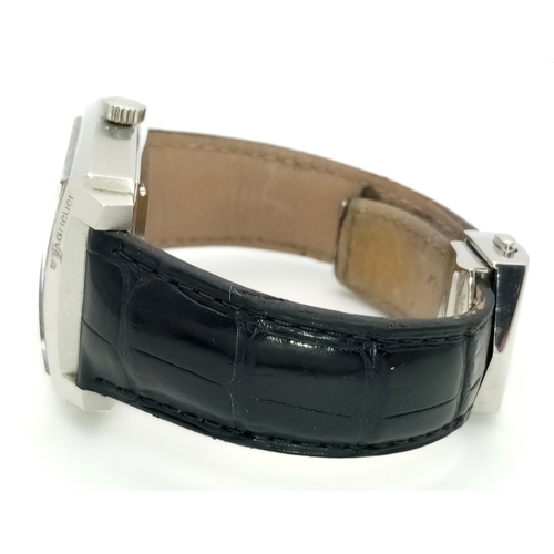 69 - A Tag Heuer Monaco Automatic Gents Watch. Model WW2110-0. Black leather strap. Stainless steel case ... 