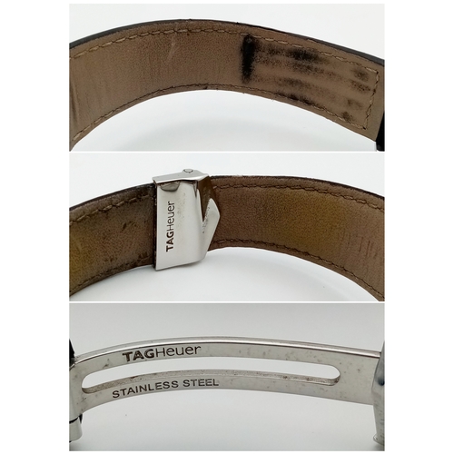 69 - A Tag Heuer Monaco Automatic Gents Watch. Model WW2110-0. Black leather strap. Stainless steel case ... 