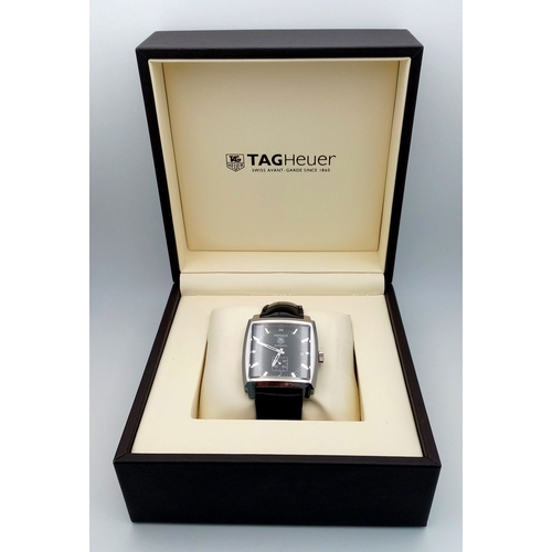 69 - A Tag Heuer Monaco Automatic Gents Watch. Model WW2110-0. Black leather strap. Stainless steel case ... 